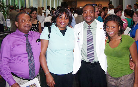 Uzoh Ikpeama is joined by his family at the School of Medicine’s White Coat Ceremony in 2010. The ceremony is a symbolic rite of passage for first-year medical students. From the left are his father, Emmanuel; mother, Louisa; Uzoh; and his sister, Chinelo. 