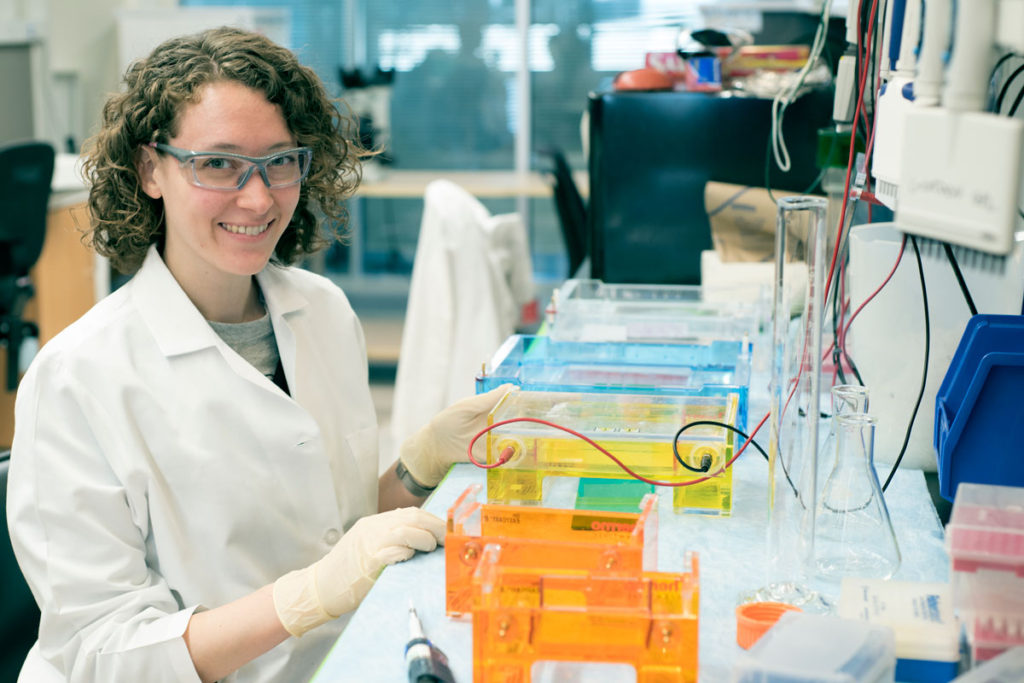 Laura VanArendonk Blanton, shown in a School of Medicine lab, will graduate in May with a doctorate in molecular genetics and genomics.