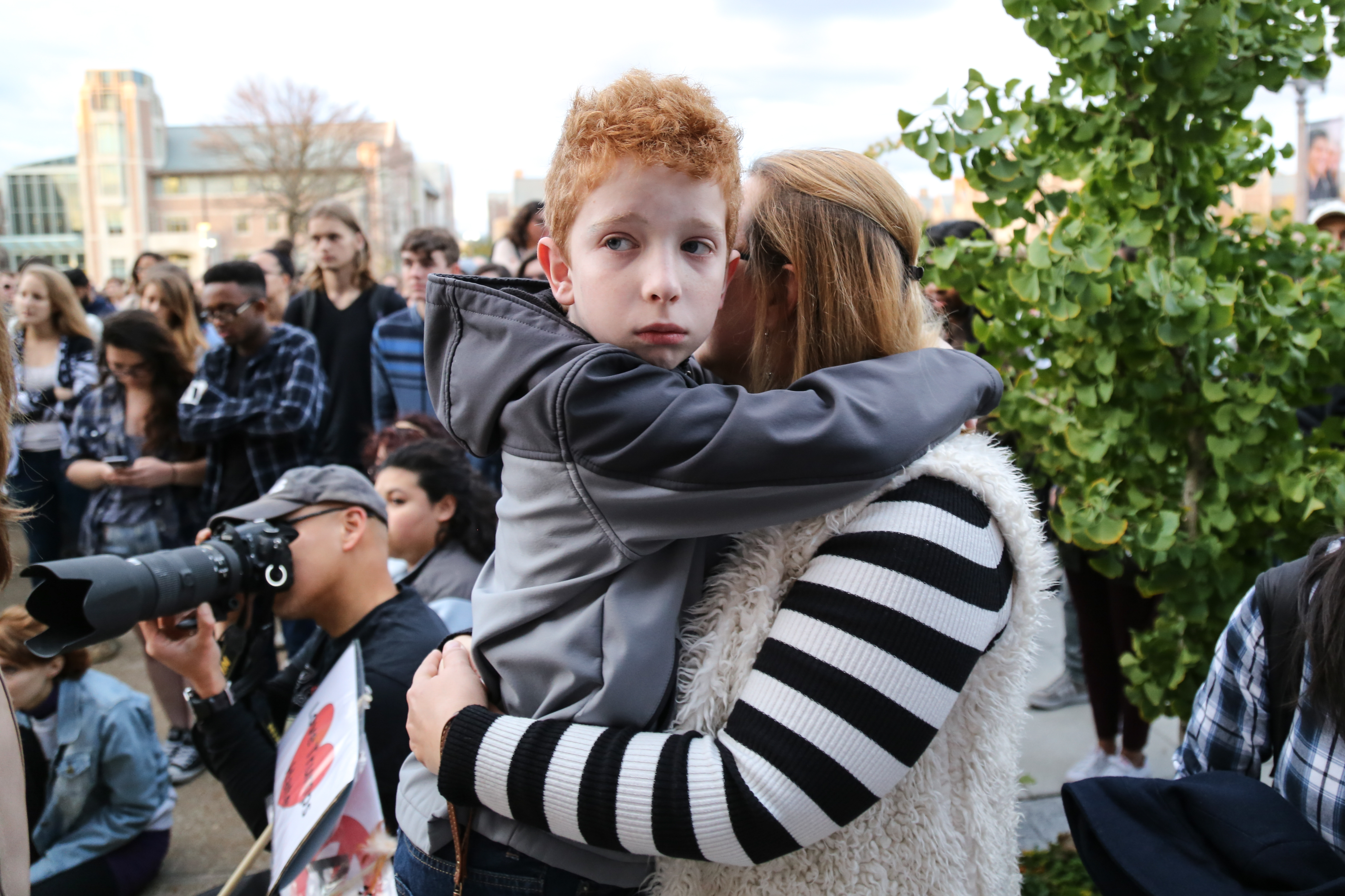 Dario, 9, and his alumna mother listen to speakers at the Love Rally outside the Danforth University Center. The rally came after Republican nominee and now president-elect Donald Trump unexpectedly won the 2016 presidential race.